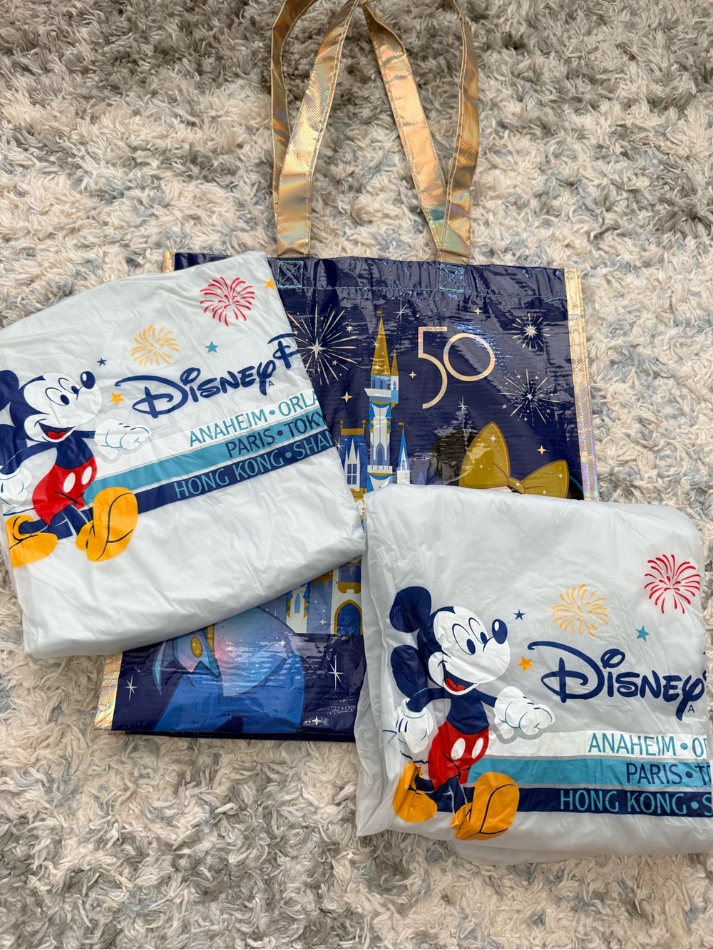New Disney Ponchos plus reusable tote, pen and autograph book